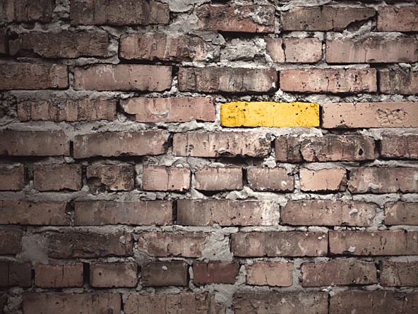 Yellow brick in wall